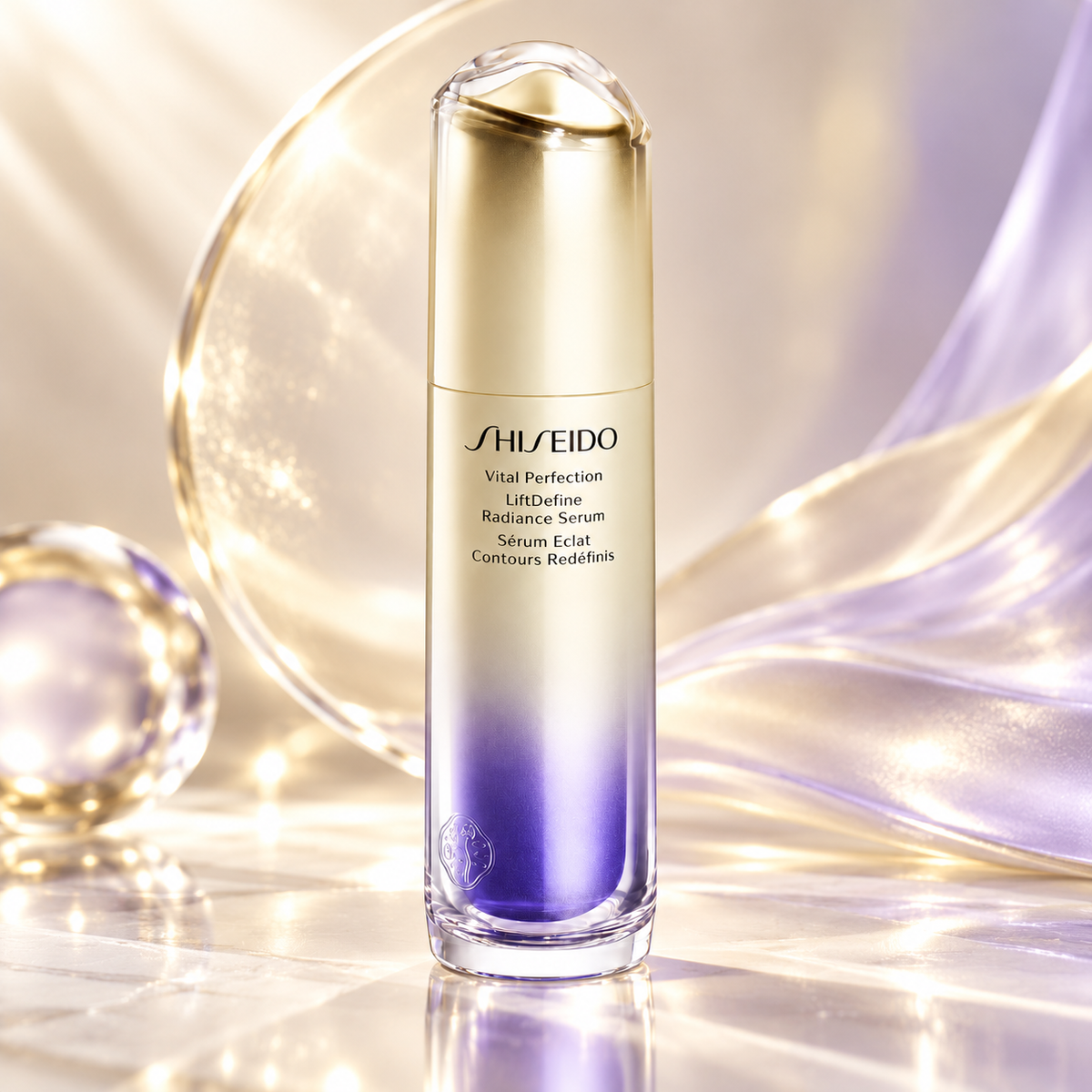 Shiseido Vital Perfection LiftDefine Radiance Serum in a luxurious gold and violet gradient bottle, displayed against an elegant champagne and lavender background with flowing silky textures, luminous reflections and a crystal sphere. Premium Japanese firming and radiance-enhancing skincare.